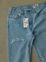 Distressed jewel flare denims