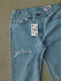 Distressed jewel flare denims